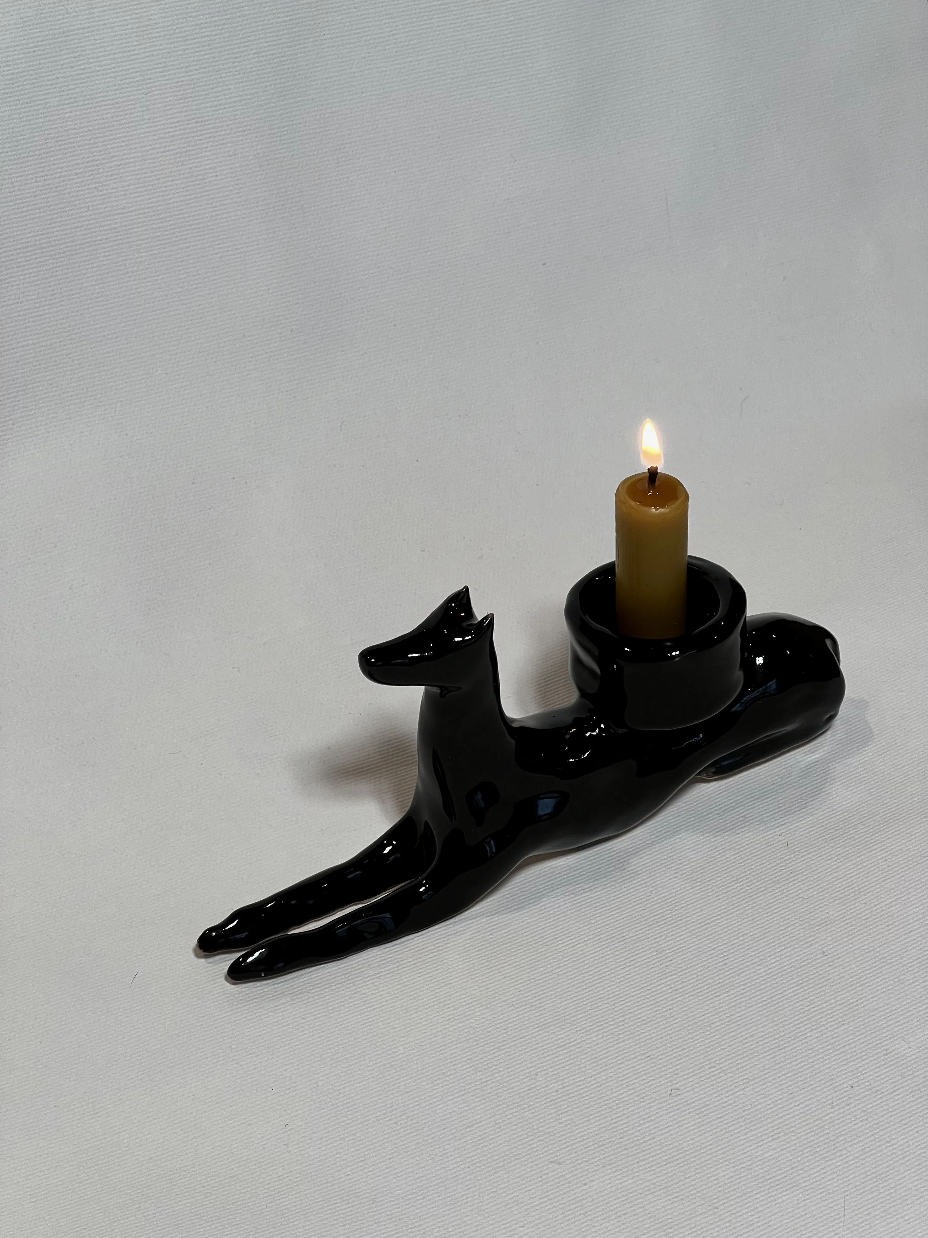 Image of “Dark dog that brings light”  by ANNA VERIKI, size: 18x6x10 cm, made of Ceramics , Sculpture medium, from Kyiv Ukraine , priced at €600 Photo 3 of 6.