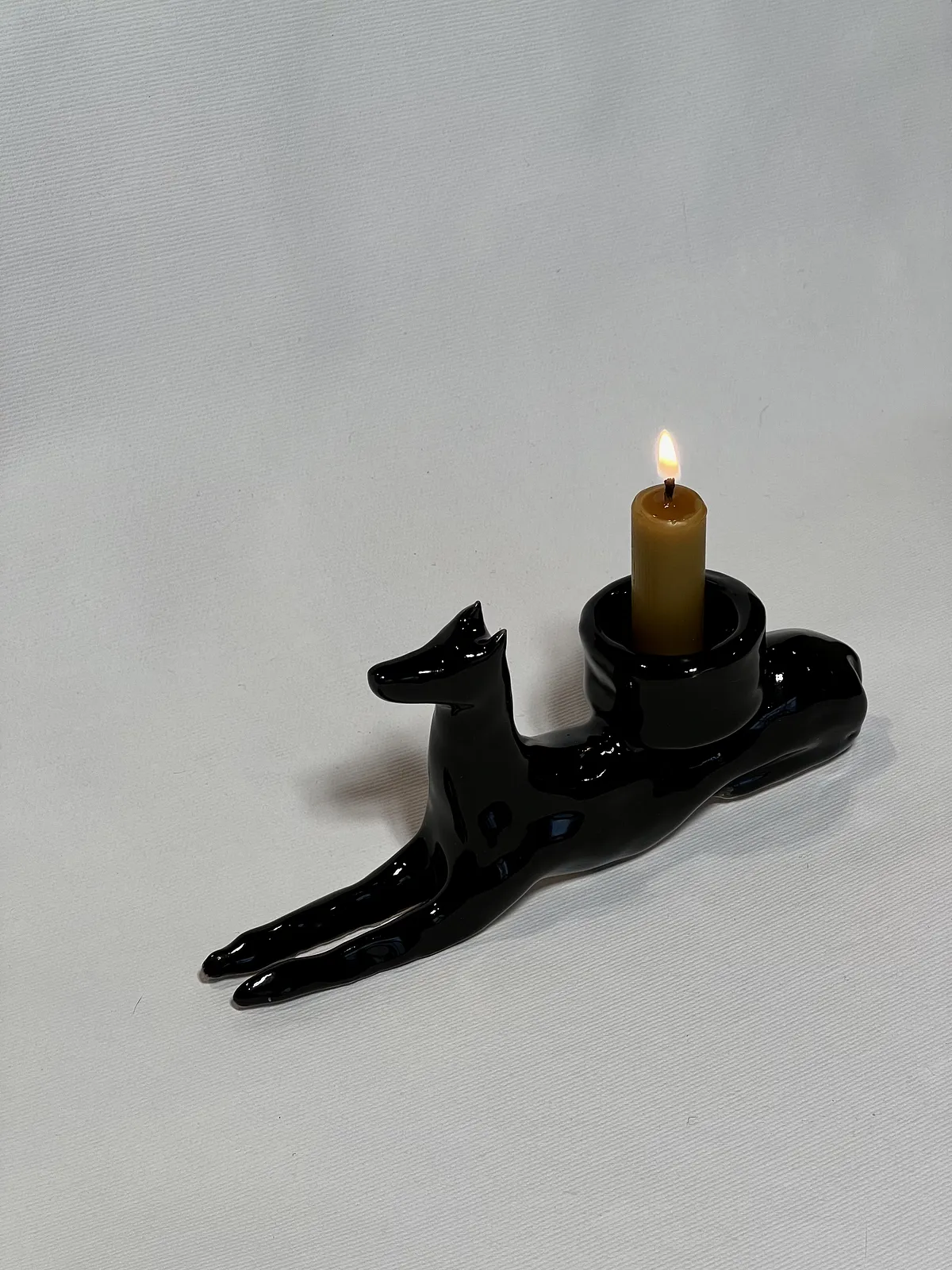 Image of “Dark dog that brings light”  by ANNA VERIKI, size: 18x6x10 cm, made of Ceramics , Sculpture medium, from Kyiv Ukraine , priced at €600 Photo 3 of 6.