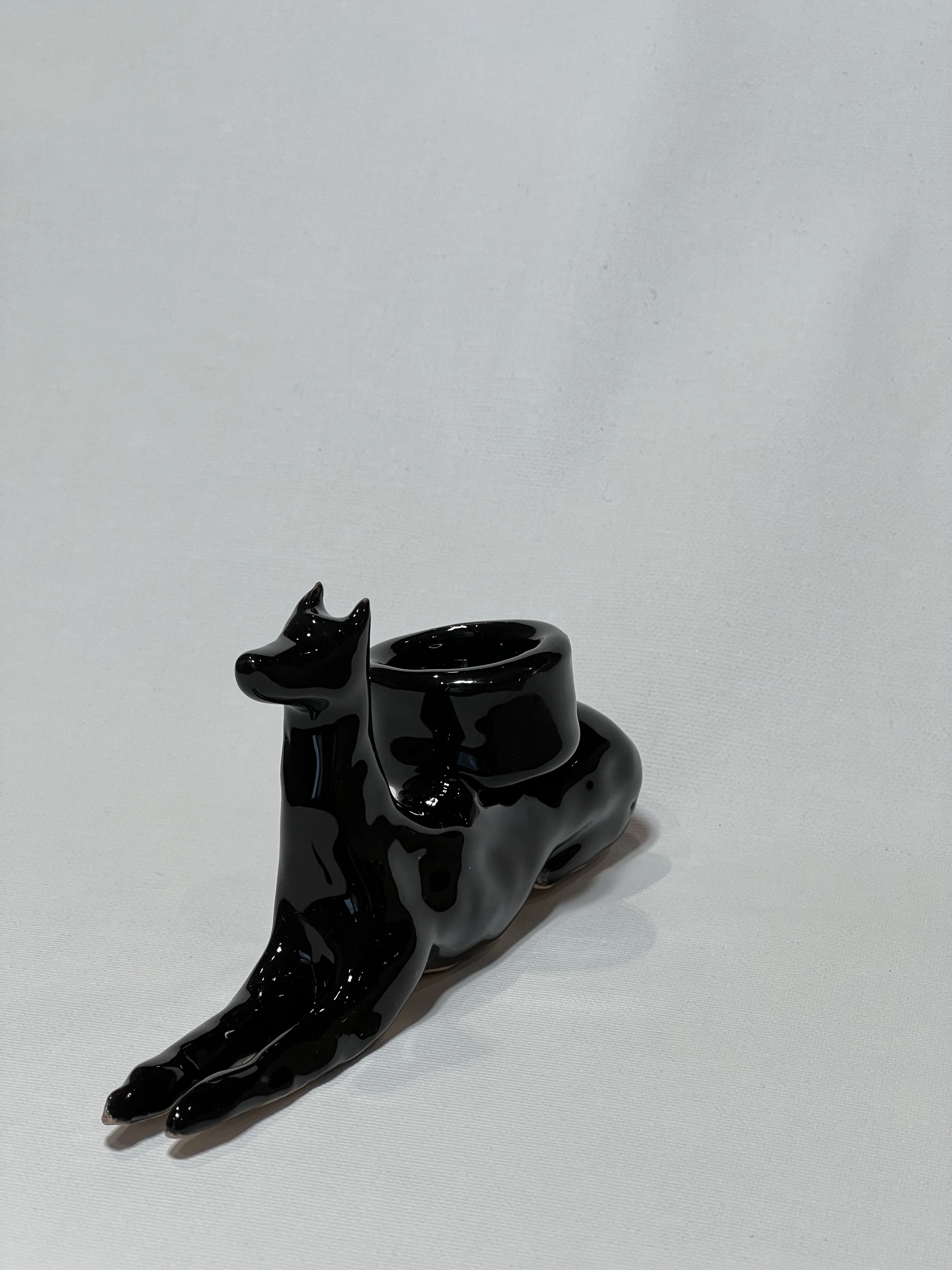 Image of “Dark dog that brings light”  by ANNA VERIKI, size: 18x6x10 cm, made of Ceramics , Sculpture medium, from Kyiv Ukraine , priced at €600 Photo 6 of 6.