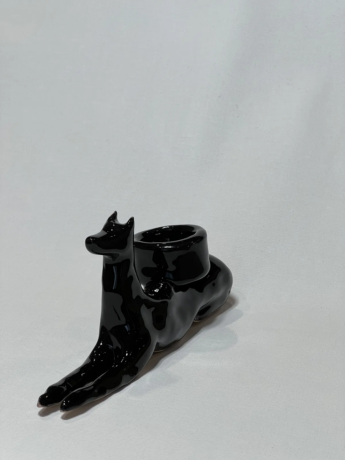 Image of “Dark dog that brings light”  by ANNA VERIKI, size: 18x6x10 cm, made of Ceramics , Sculpture medium, from Kyiv Ukraine , priced at €600 Photo 6 of 6.