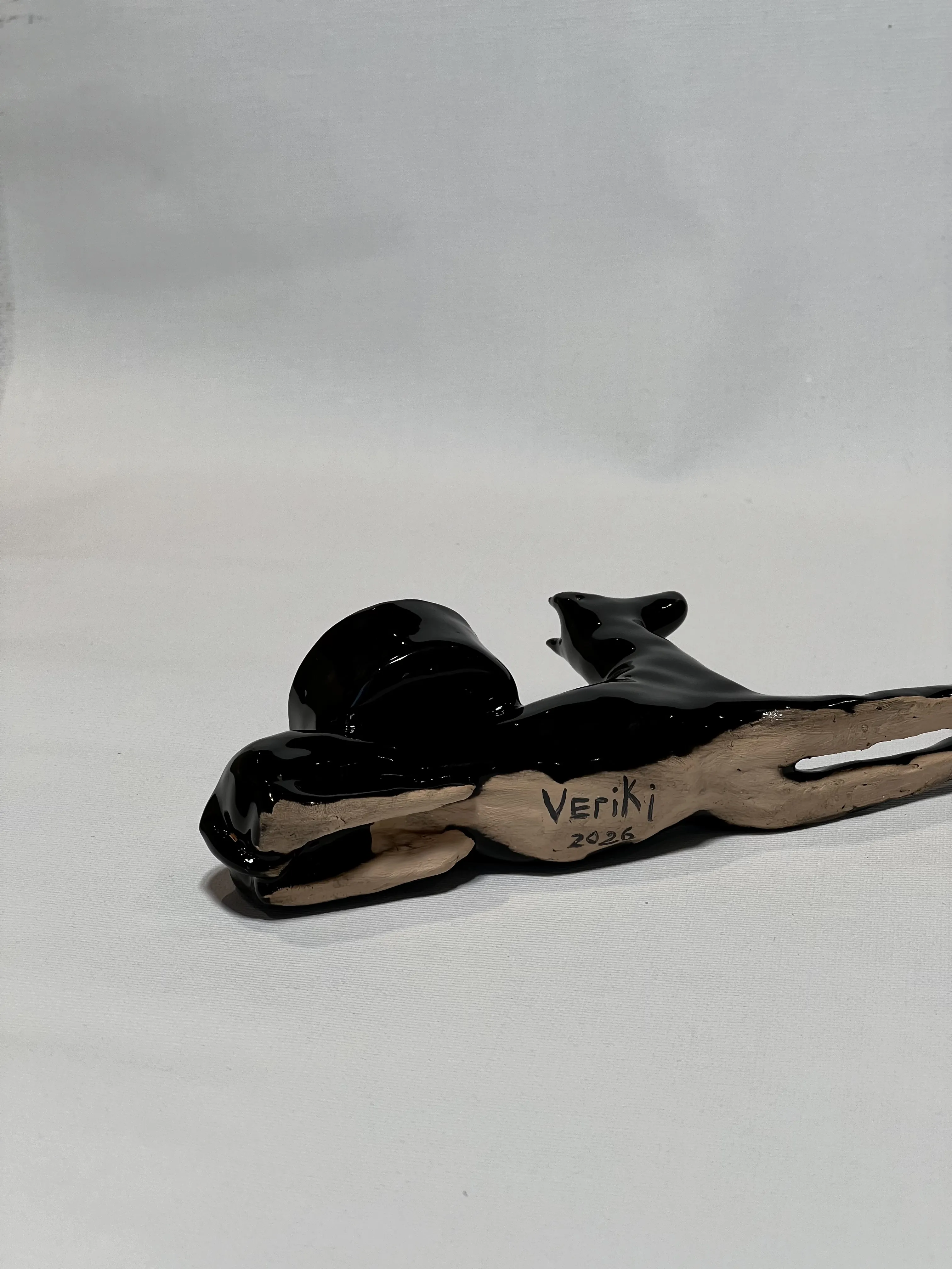 Image of “Dark dog that brings light”  by ANNA VERIKI, size: 18x6x10 cm, made of Ceramics , Sculpture medium, from Kyiv Ukraine , priced at €600 Photo 5 of 6.