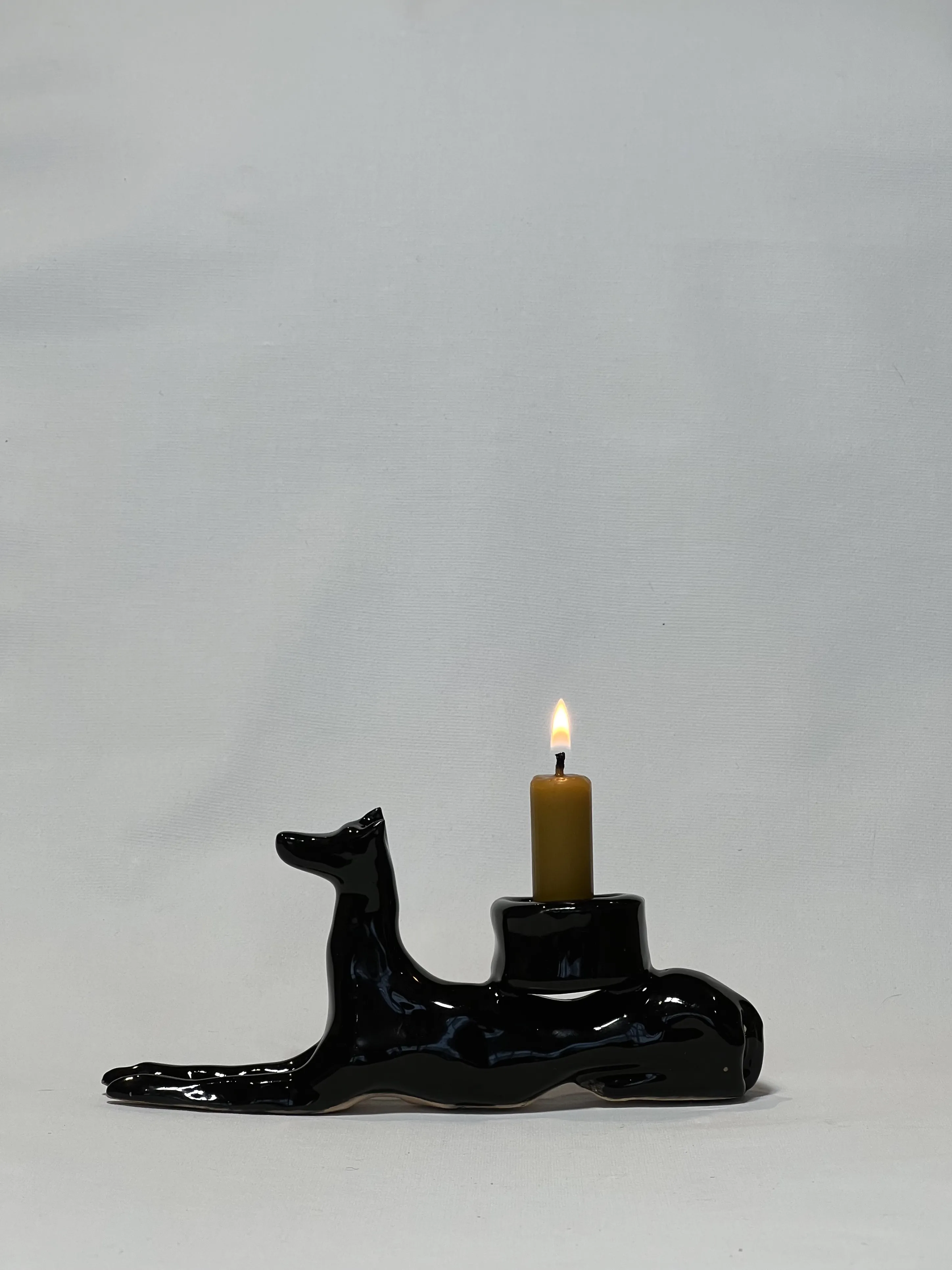 Image of “Dark dog that brings light”  by ANNA VERIKI, size: 18x6x10 cm, made of Ceramics , Sculpture medium, from Kyiv Ukraine , priced at €600 Photo 4 of 6.